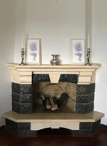 fireplace decor with silver items