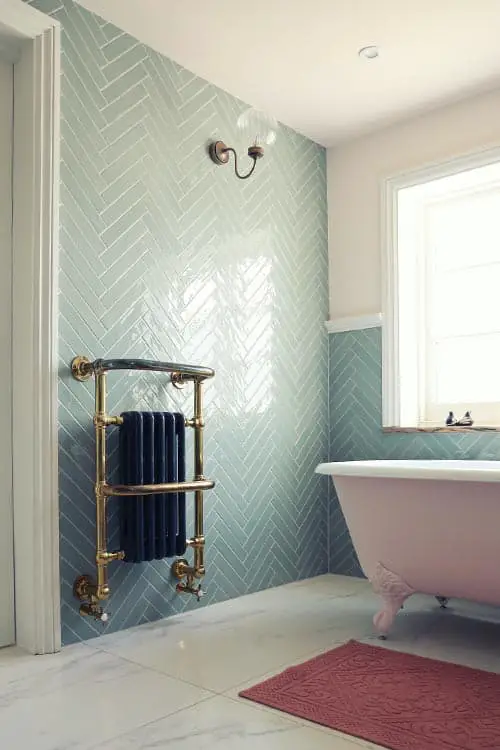 herringbone style light green bathroom tiles